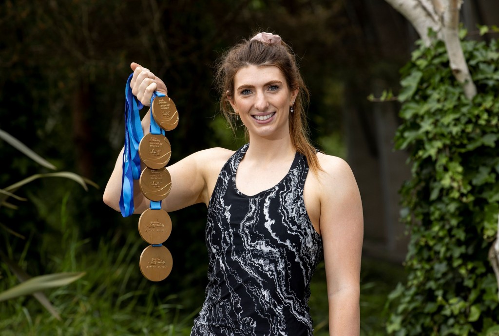 Paralympian Bethany Firth pictured with her World Championship medals (2022).