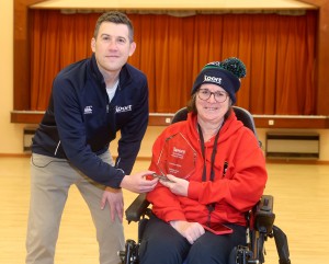 Sport NI’s David Smyth presents Caroline Millar with her SportMaker Disability Coach of the Year award