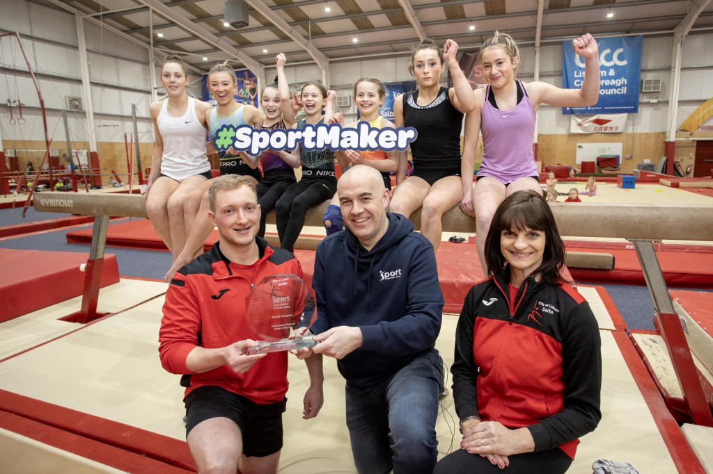 SportMaker Performance Pathway Coach of the Year David Carleton (Left) celebrating with Sport NI’s Simon Toole (Centre), Amanda McMaster from Salto Gymnastics (Right) and gymnasts. 