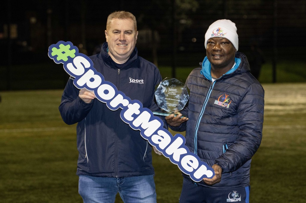 SportMaker Community Coach of the Year Jahswill Emmanuel (right) with Sport NI representative Alan Curran (left)